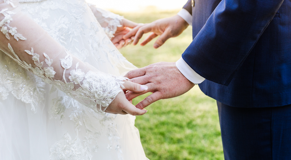 Bride and groom holding hands after their first look.