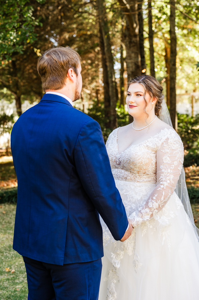 Bride gazing into her soon-to-be husband's eyes on their wedding day in Huntsville, AL