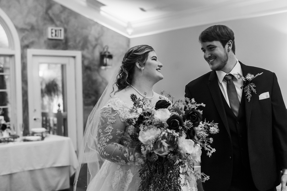 Newlywed couple making their entrance in the indoor reception space at Annabella at Cedar Glen