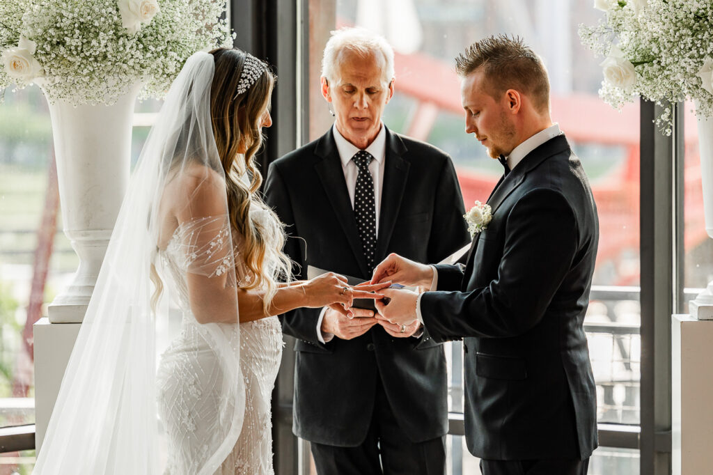 The Bridge Building bride and groom ring exchange