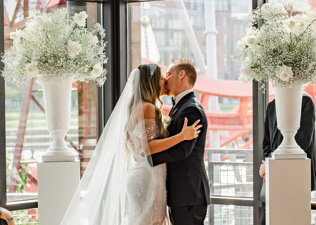 The Bridge Building bride and groom first kiss