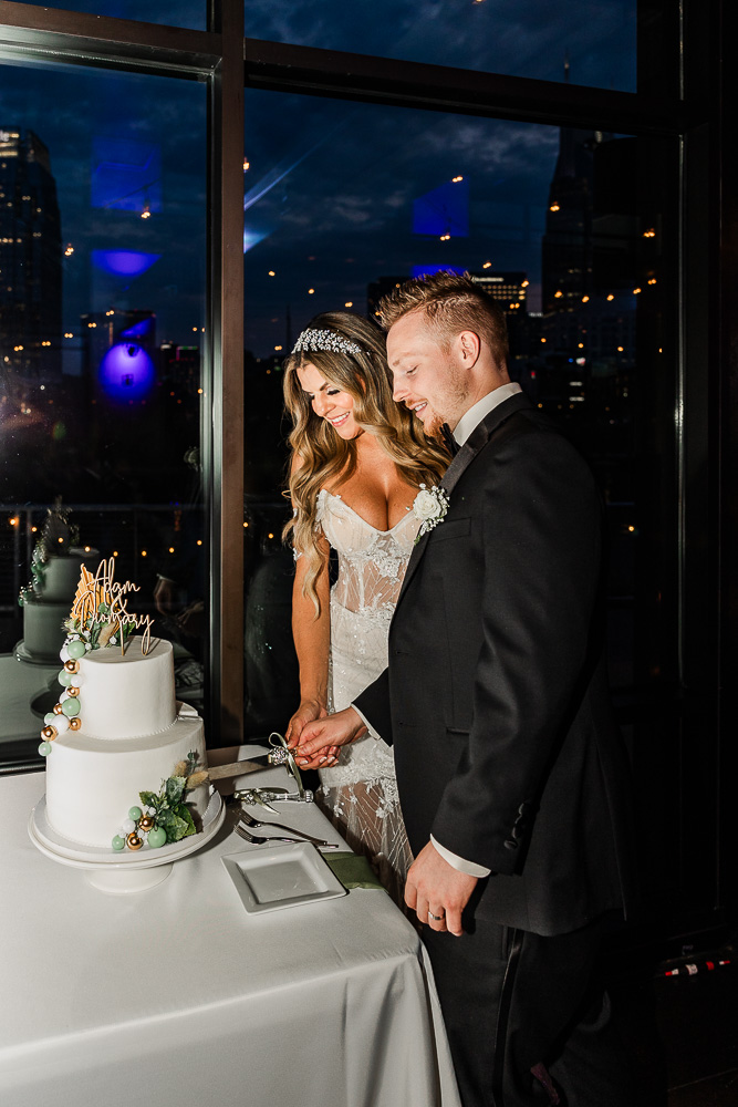 The Bridge Building bride and groom cake cutting