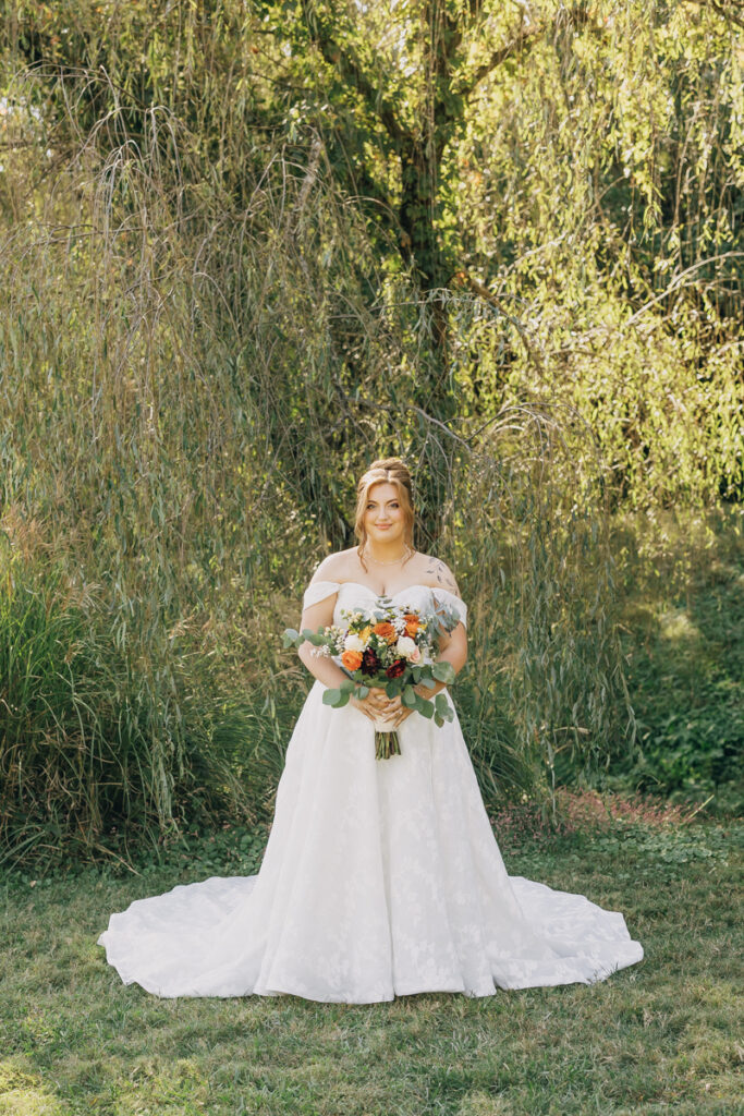 Bride smiling at the camera on her wedding day