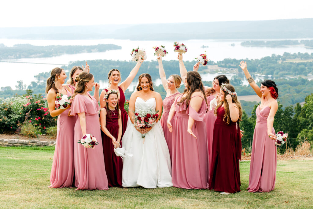 Bridesmaids and flower girls cheering on the bride.