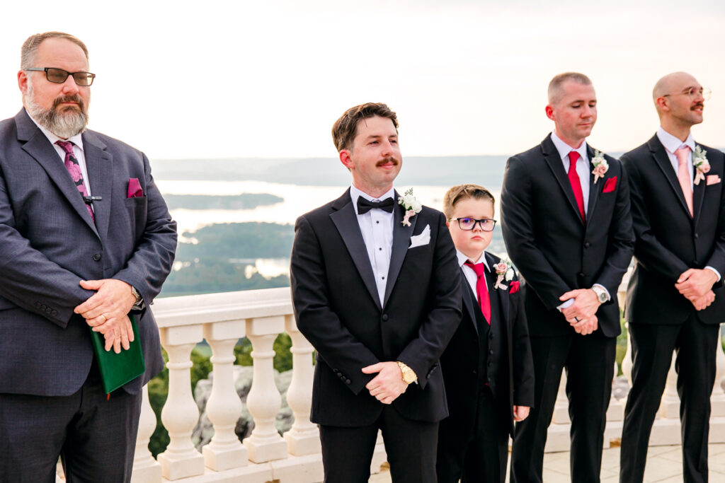 Groom admiring his bride as she walks down the aisle.
