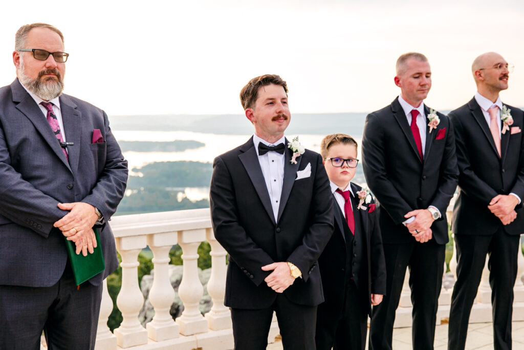Groom admiring his bride as she walks down the aisle.