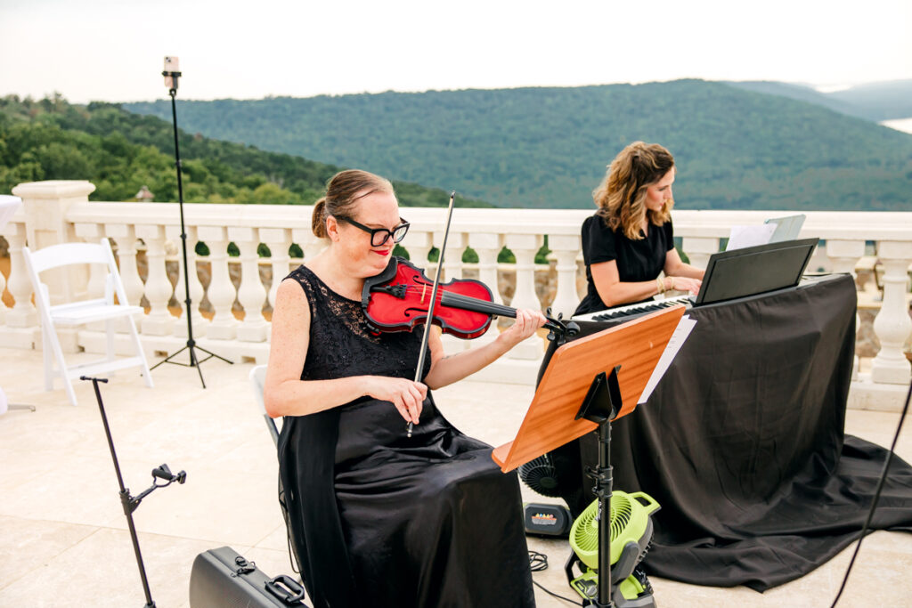 Susie Shortt playing music before the ceremony starts.