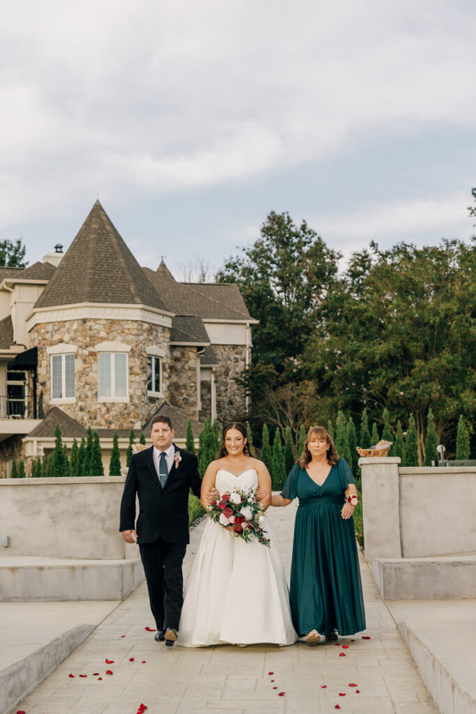 Bride walking down the aisle at Stone Haven venue's outdoor patio