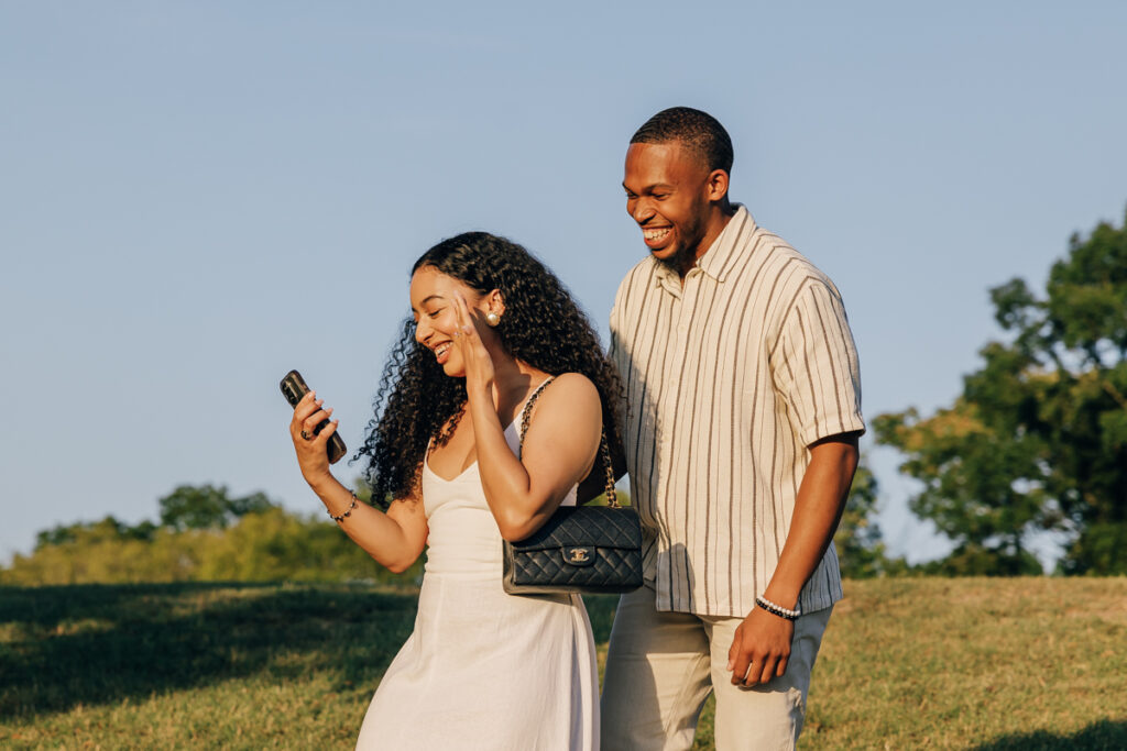 Newly engaged couple calling loved ones from Arrington Vineyards