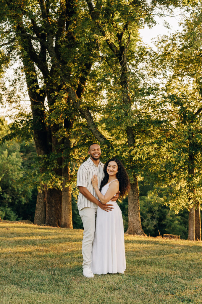 Bride and groom-to-be smiling after engagement