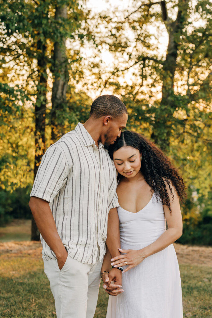 Romantic moment of couple holding hands at Arrington Vineyards in Nashville