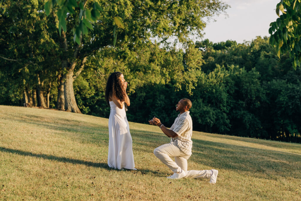 Man proposing on one knee at Arrington Vineyards
