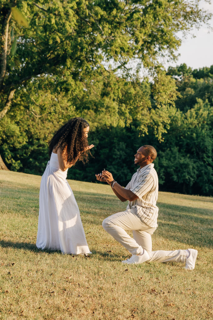 Christian proposing to Jennifer on one knee at Arrington Vineyards