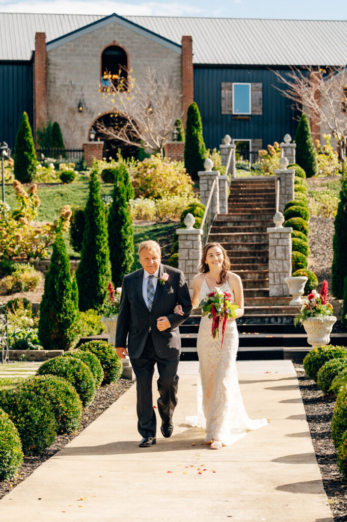 Bride walking down the aisle during Tayvin Gardens wedding in Smiths Grove, Kentucky.
