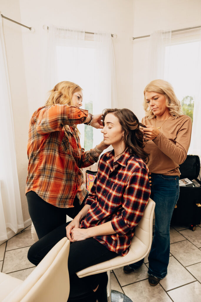 Bride getting her hair done in the bridal suite at Tayvin Gardens