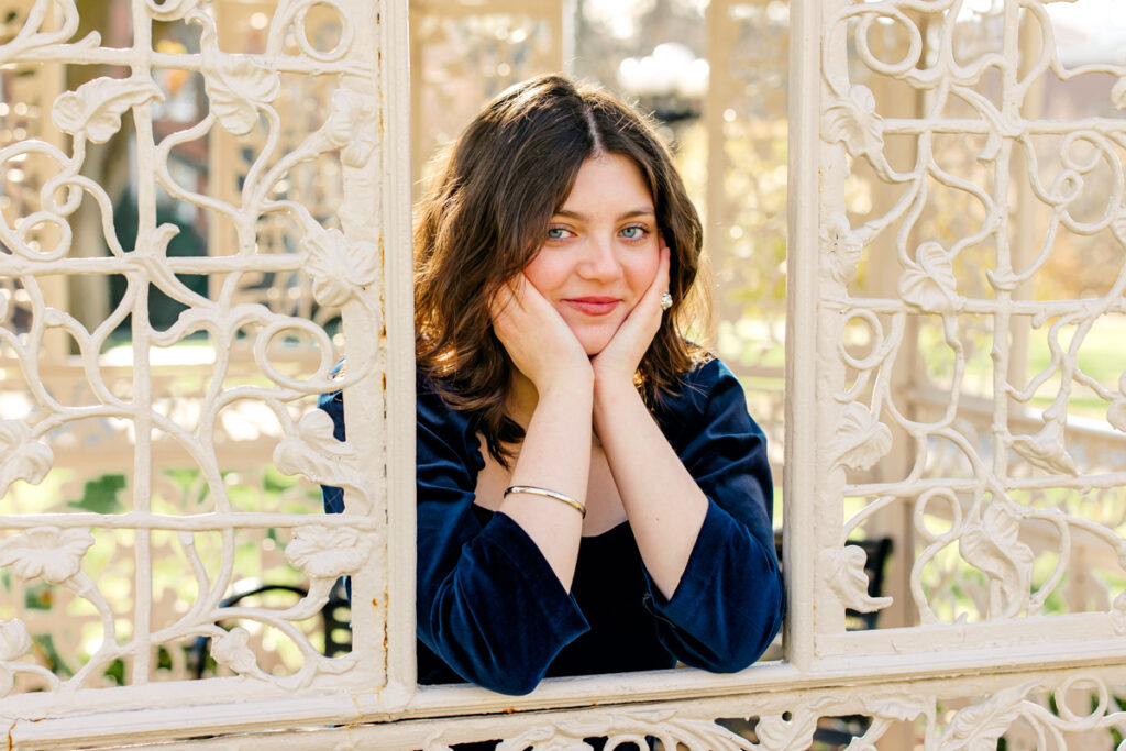 Nashville senior photography session with senior leaning her chin into her hands.