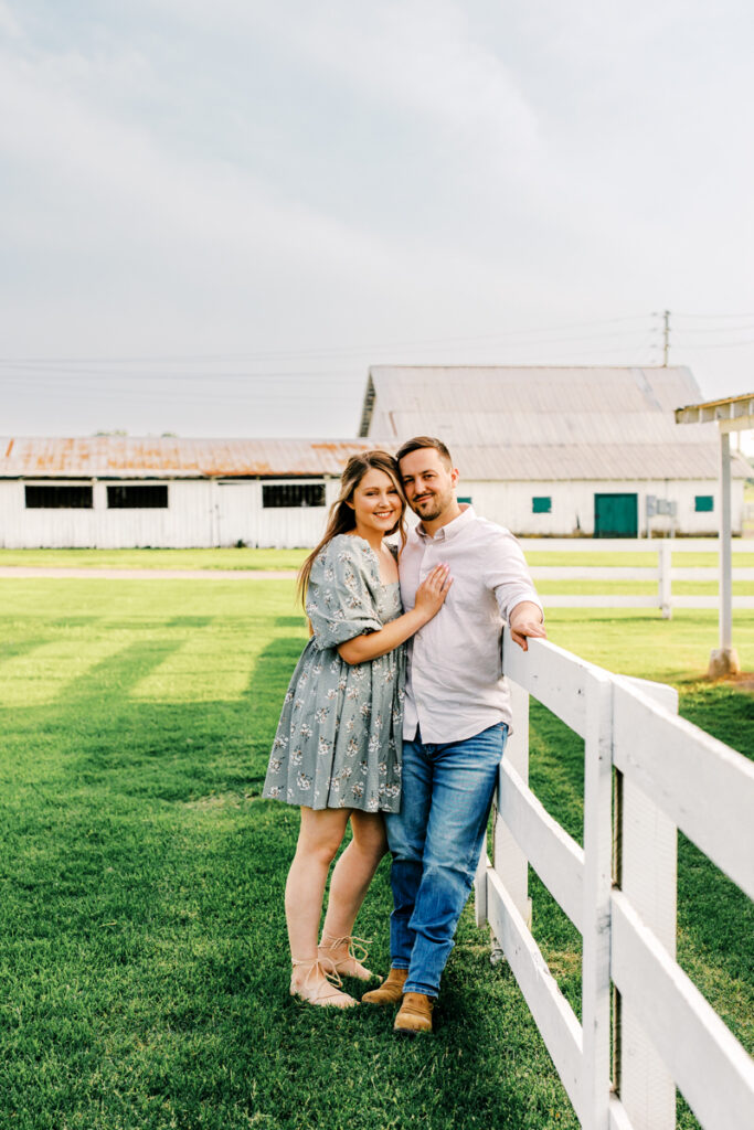 Man and woman smiling cheek to cheek during their engagement session in Franklin, TN