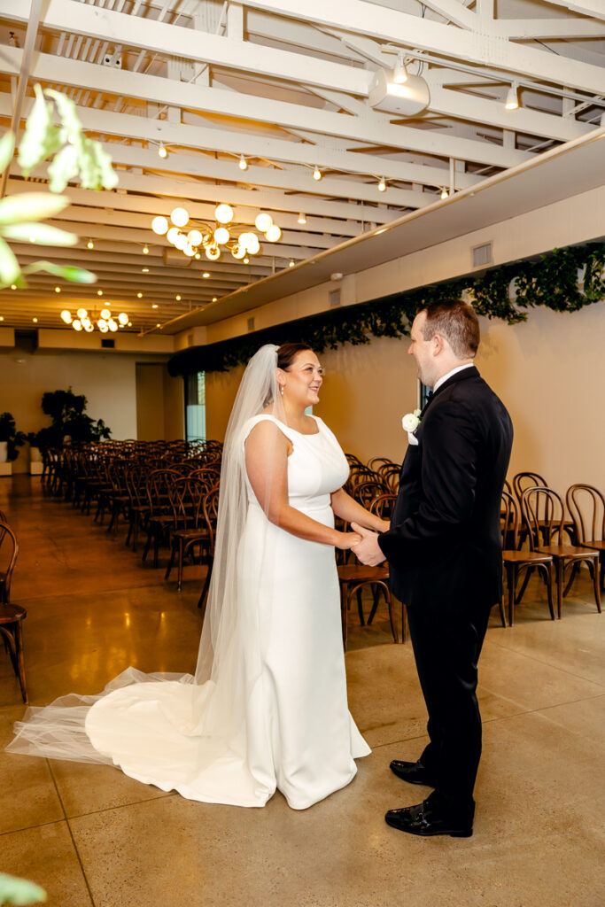 Bride and groom during their first look at Saint Elle