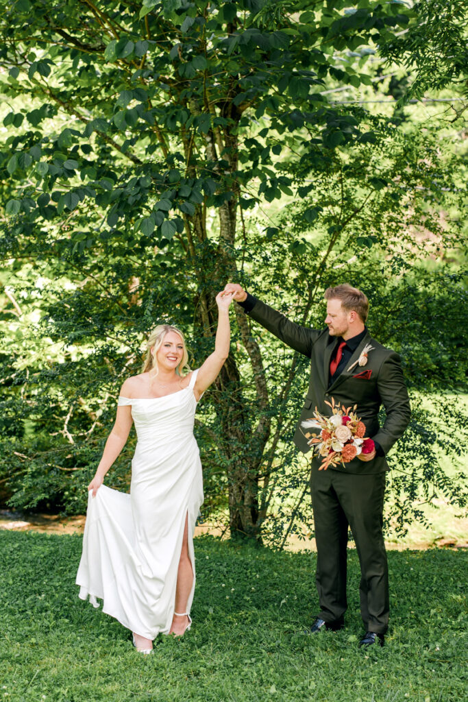 Groom twirling the bride