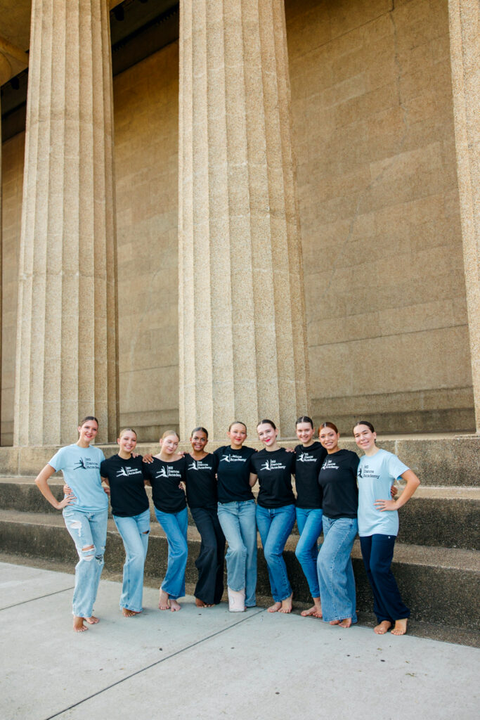 Group of NS Dance Academy dancers at The Parthenon wearing t-shirts and jeans