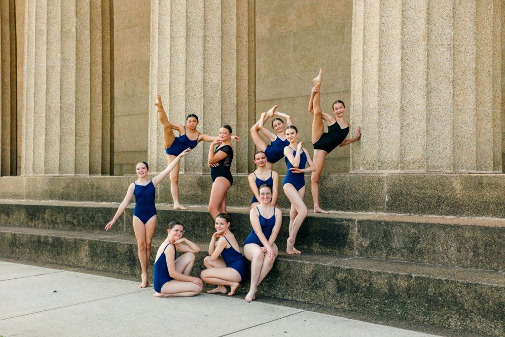 Ten dancers posing on the steps of The Parthenon during their 2025 season photo session.