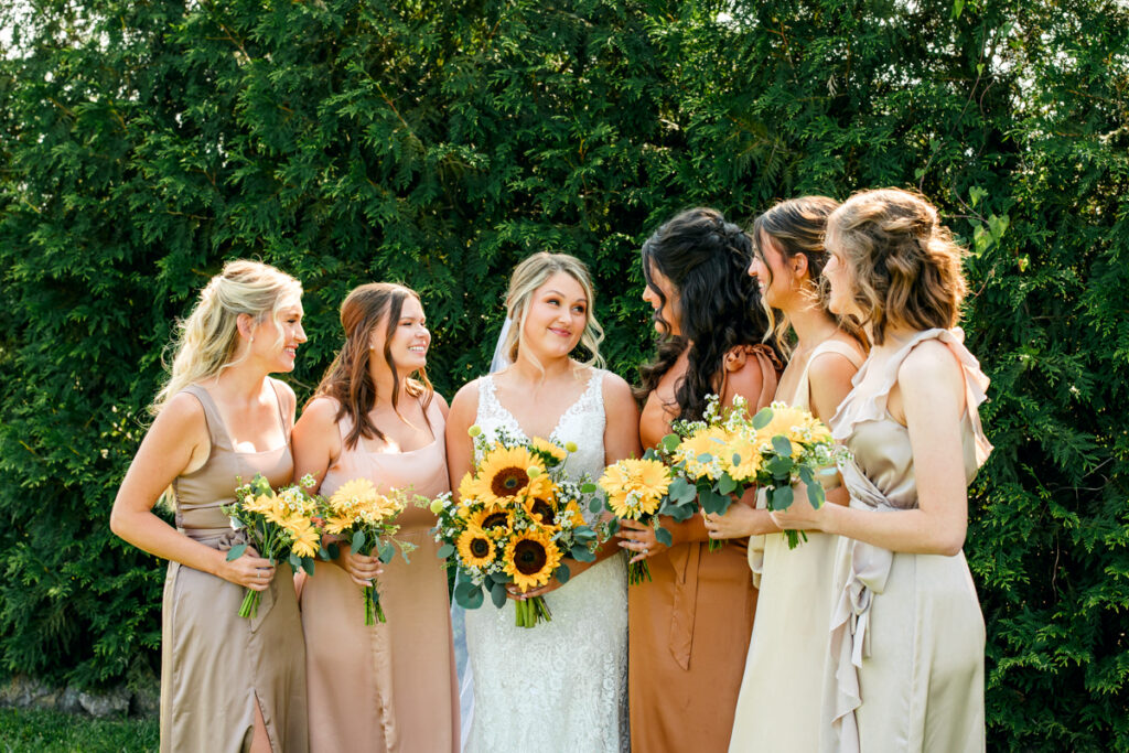 Bride with her bridesmaids at Allenbrooke Farms wedding venue