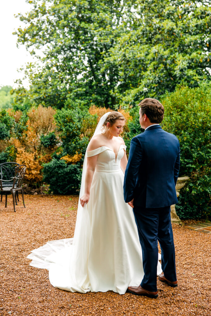 Bride and groom during their first look at Homestead Manor