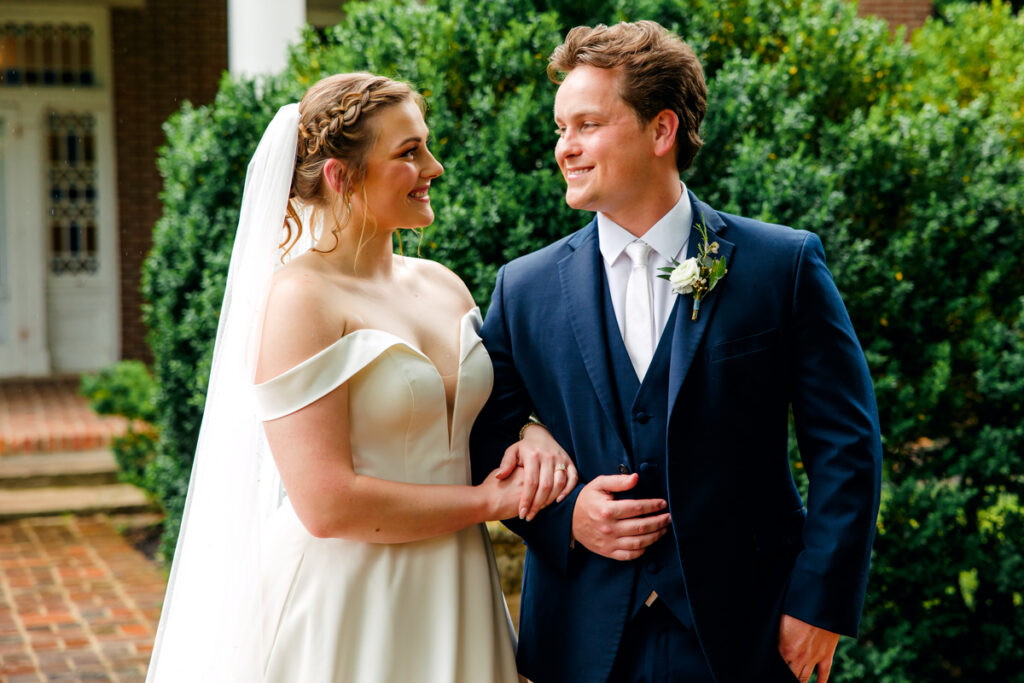 Bride and groom gazing at each other after their first look at Homestead Manor in TN