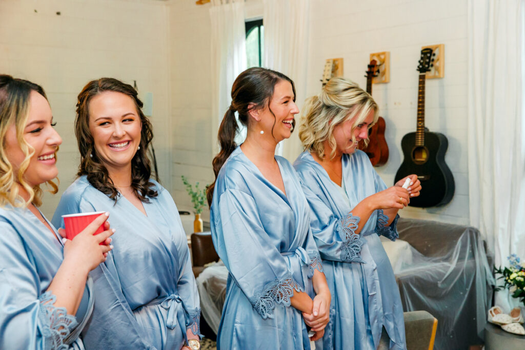 Bridesmaids reacting to see the bride in her dress for the first time