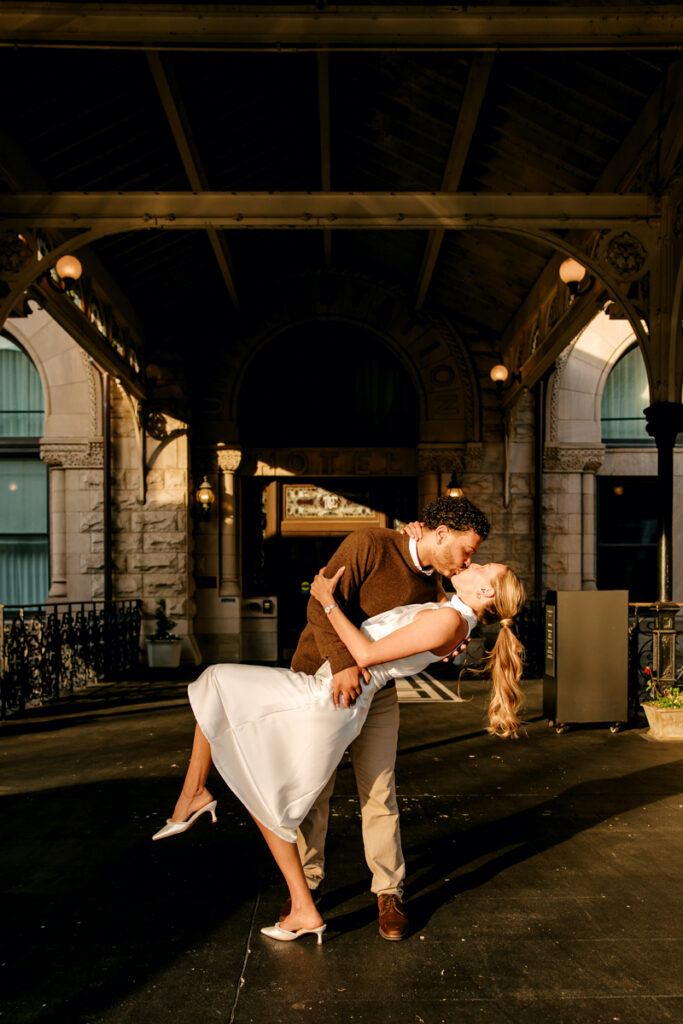 Guy dipping his fiancé during their Union Station engagement session