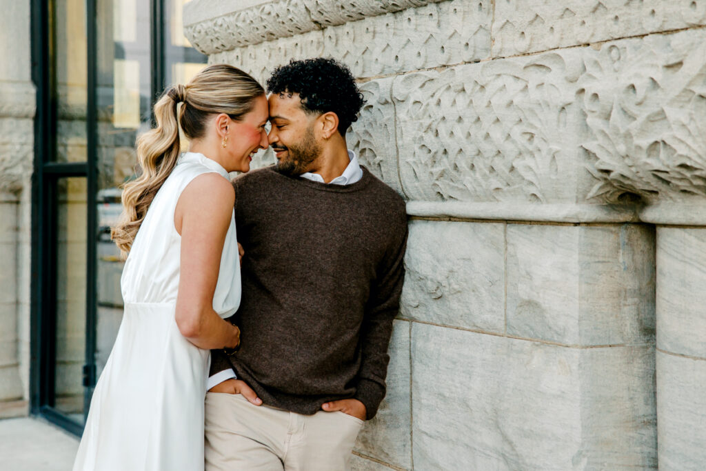 Engaged couple outside of Union Station Hotel in Downtown Nashville