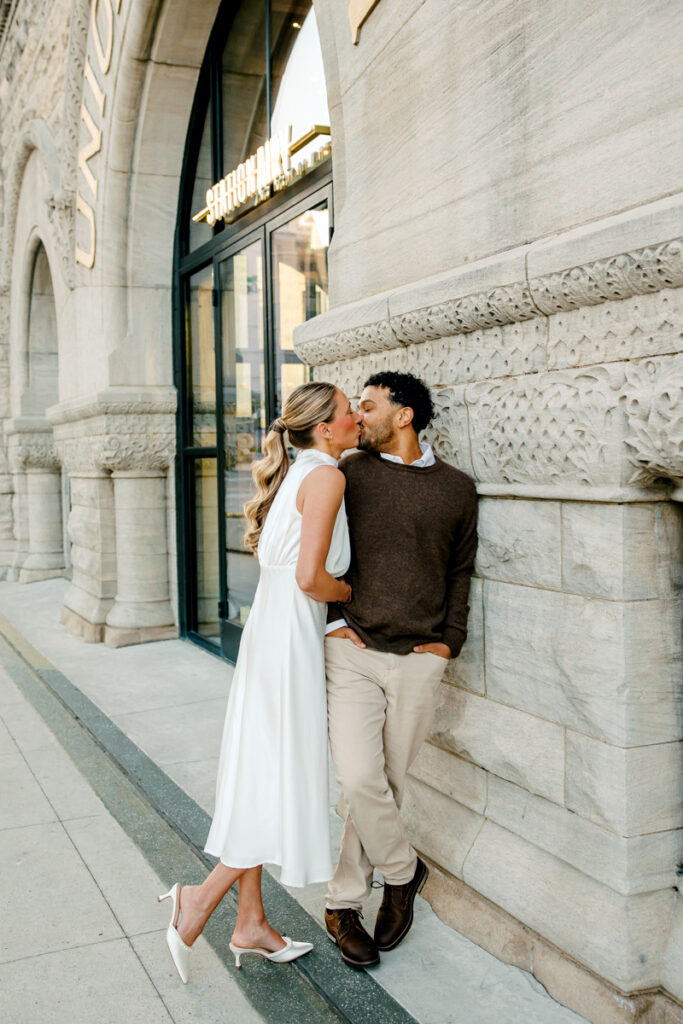 Couple sharing a romantic moment during their Union Station engagement session in Nashville