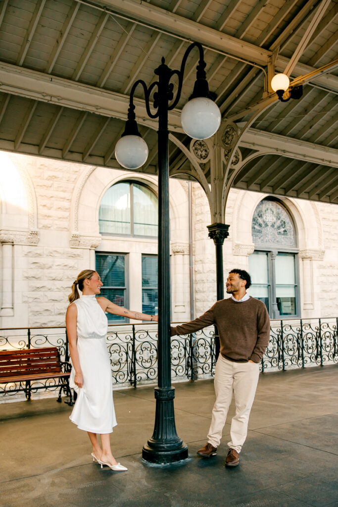 Couple during their engagement session outside Union Station Hotel in Nashville