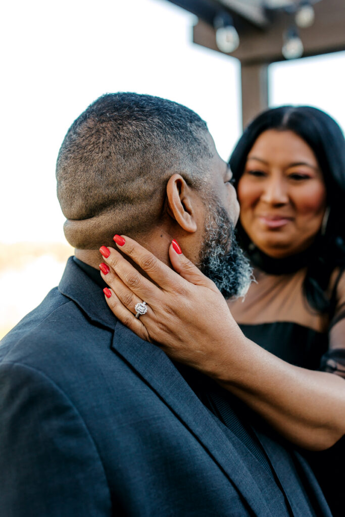 Black engaged couple showing off her diamond ring during their Hendersonville, TN engagement session.