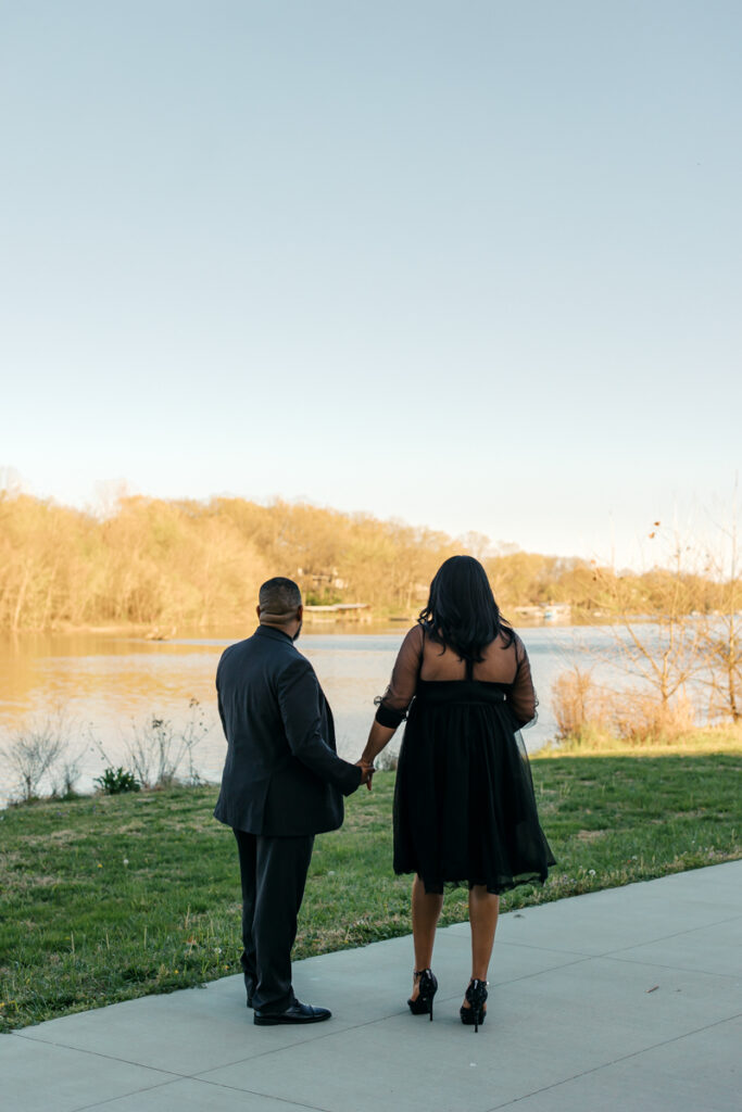 Engaged couple taking in the scenic view during their engagement photos in Hendersonville, TN