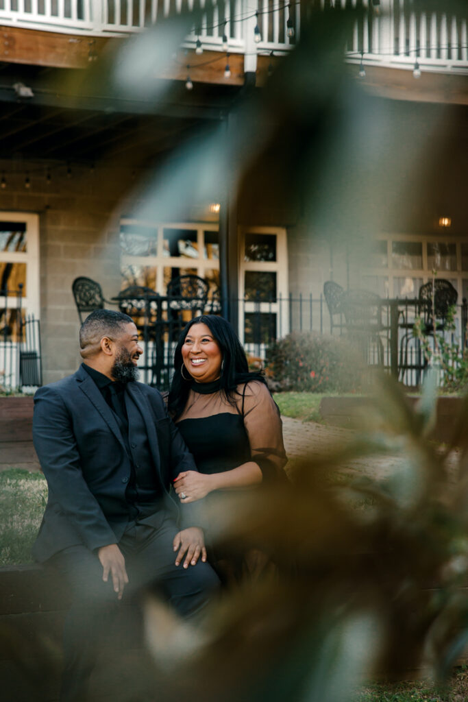 Black engaged couple sharing laughs together during their engagement photos in Hendersonville, TN