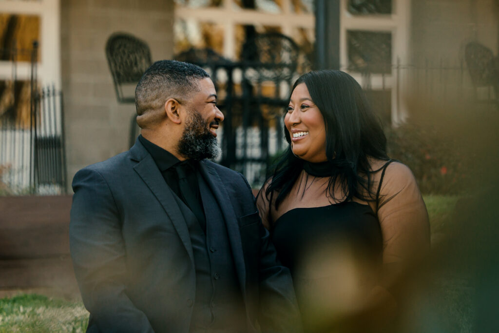 Couple gazing at each other with big smiles while taking engagement photos in Hendersonville, TN