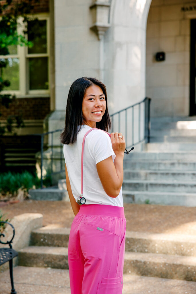 Nashville graduation portrait session with nursing grad holding a stethoscope over her shoulder