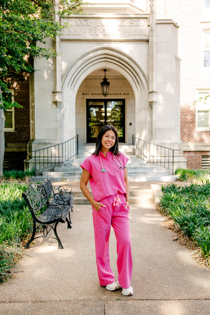 Nursing graduate in scrubs during a Nashville graduation portrait session