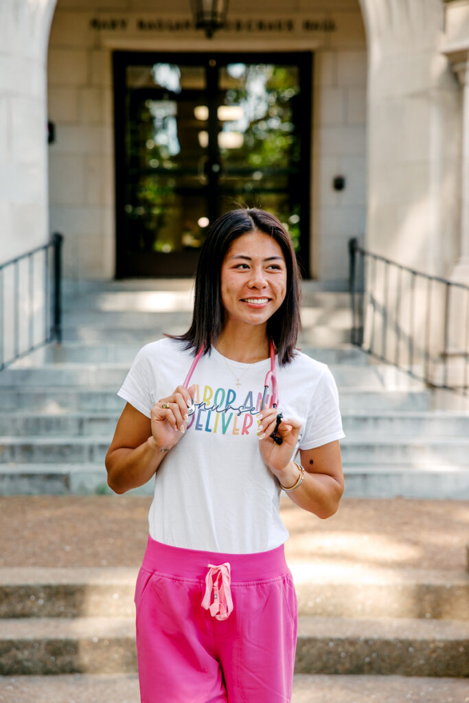 Vanderbilt nursing graduate gazing into the distance with a stethoscope around her neck
