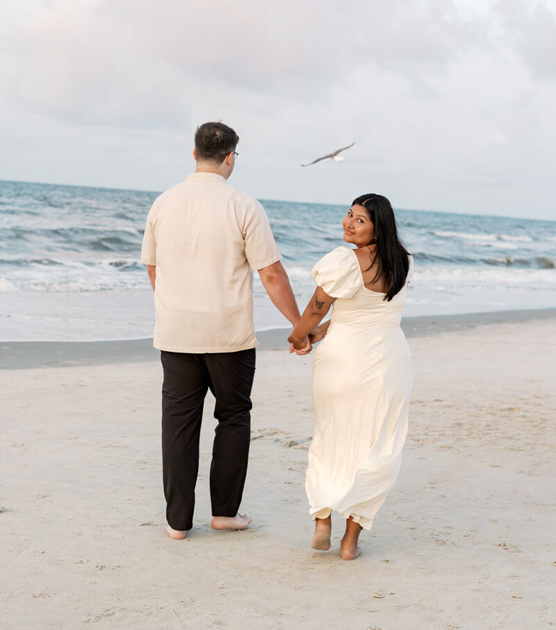 Couple walking along the beach in Hilton Head