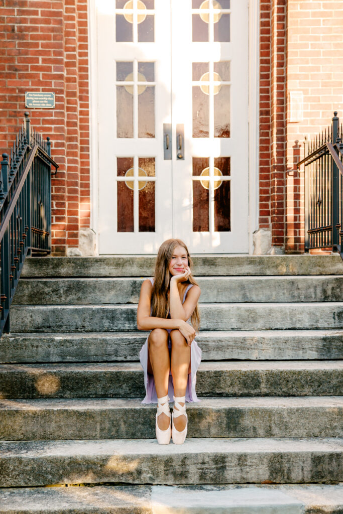 Outdoor ballet photos of a dancer sitting on steps in Franklin, Tennessee